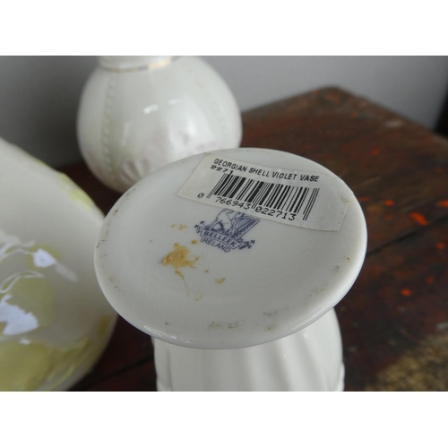 73 - A large collection of Belleek pottery.