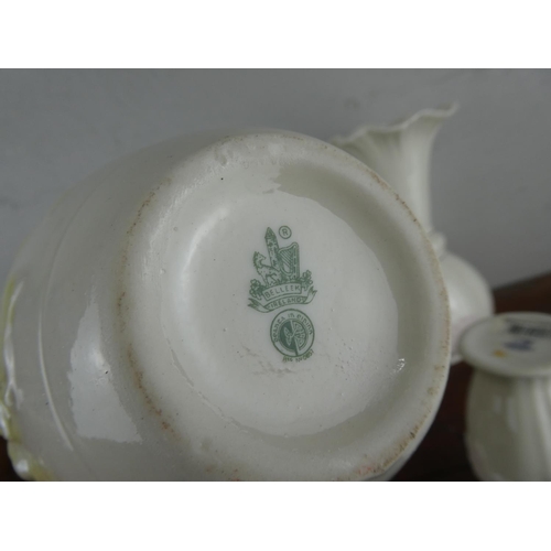 73 - A large collection of Belleek pottery.