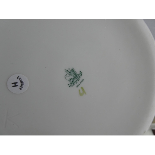 73 - A large collection of Belleek pottery.