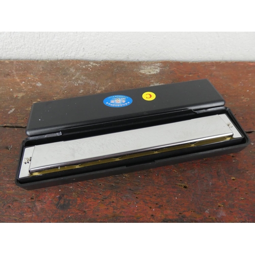 75 - A cased Performance Harmonica 24.