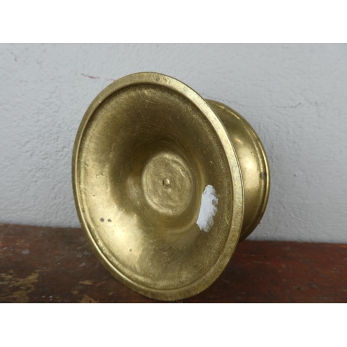 77 - A heavy brass candleholder.