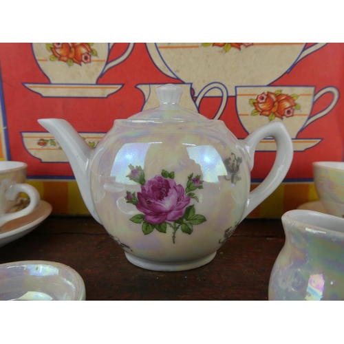 84 - A vintage boxed child's tea set.