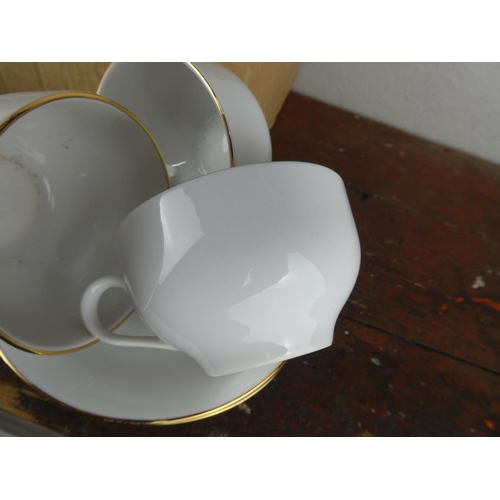 85 - A boxed Harmony bone china tea set.