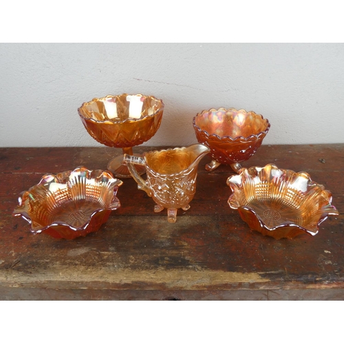 90 - A collection of five pieces of carnival glass ware.