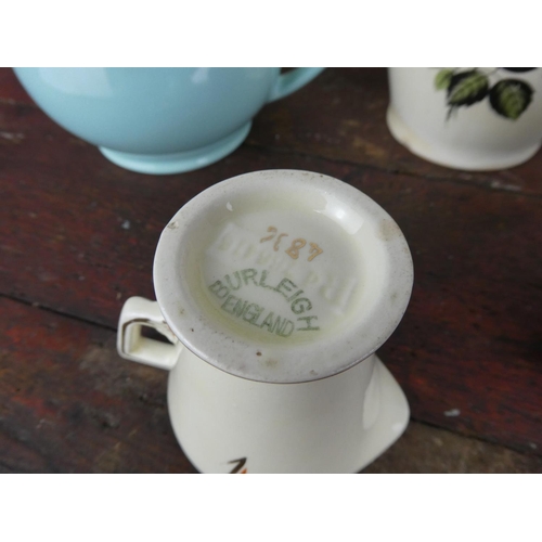 95 - A vintage Elijah Cotton floral jug, a pair of British Anchor blue glaze jugs and more.