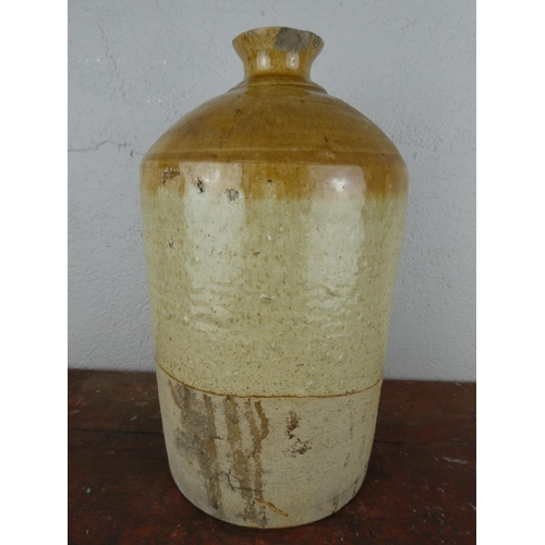 99 - A vintage J & J P McNally, Newry stoneware flagon, measuring 12