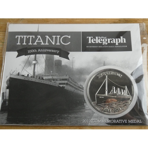 211 - A Belfast Telegraph 2012 commemorative medal celebrating Titanic 100th anniversary and a book 'Lost ... 