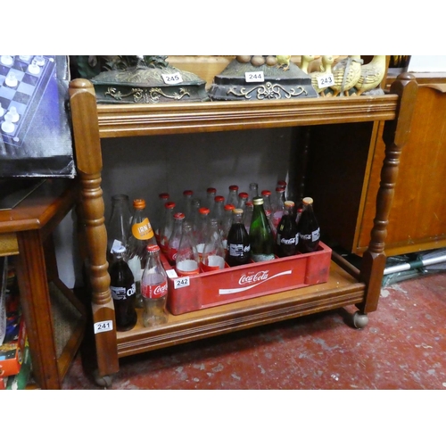 241 - A vintage wooden drinks trolley.