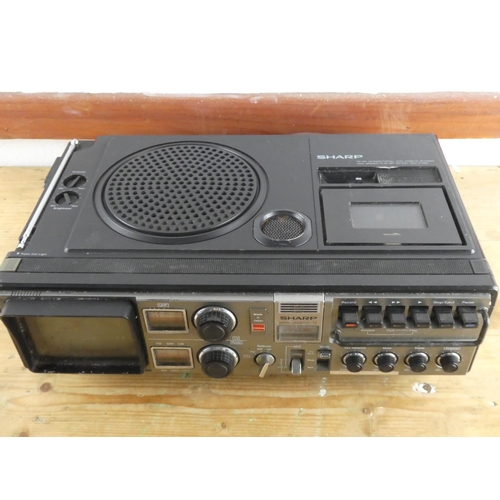 251 - A vintage Sharp radio, cassette and tv.