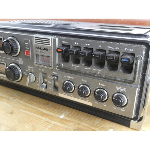251 - A vintage Sharp radio, cassette and tv.