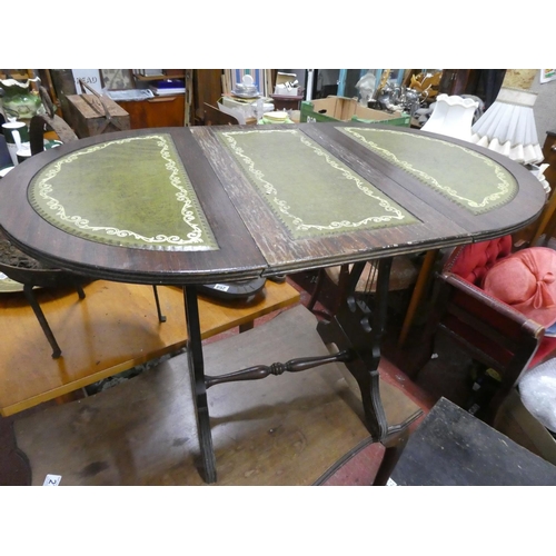 274 - A small drop leaf table with leather top.