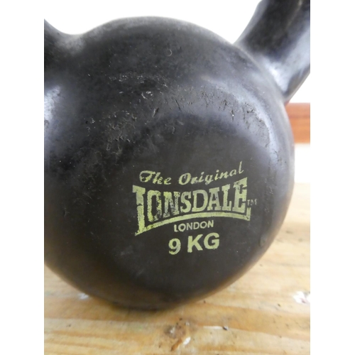 293 - An old kettle bell weight.