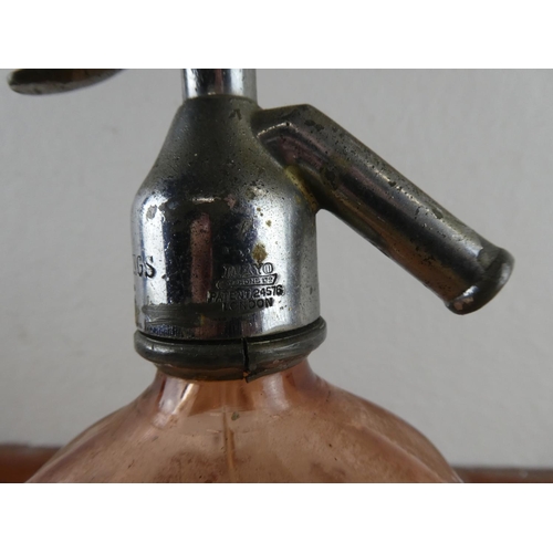300 - An antique Briggs, Belfast coloured glass soda syphon.
