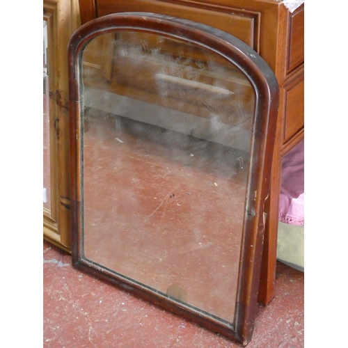 338 - An antique mahogany arched top mirror, measuring 57cm x 50cm.