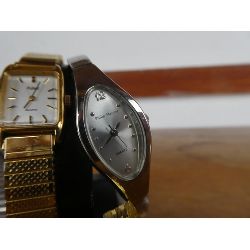 65 - A cased vintage Pulsar ladies wrist watch and three others.