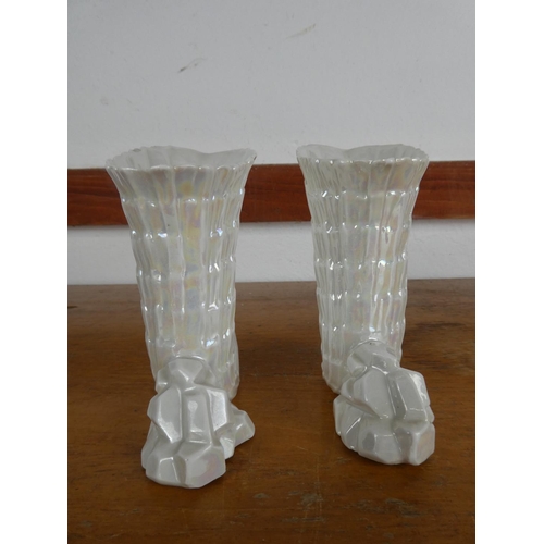 79 - A pair of decorative ceramic vases, measuring 14cm tall.