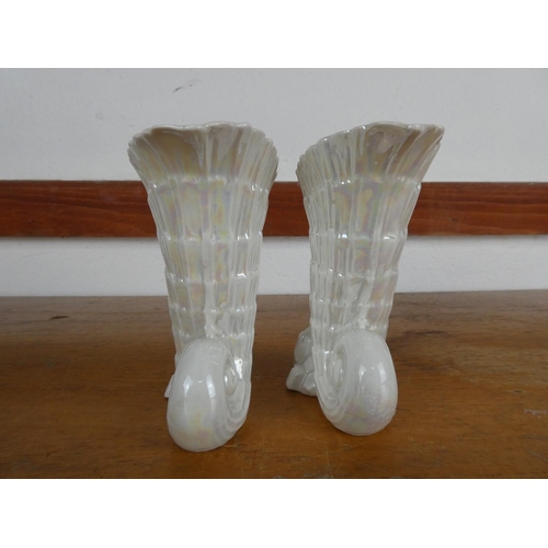 79 - A pair of decorative ceramic vases, measuring 14cm tall.