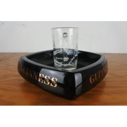 121 - A large Henry King & Co Guinness ashtray and a Guinness glass tankard.