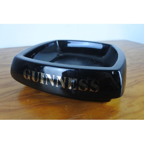 121 - A large Henry King & Co Guinness ashtray and a Guinness glass tankard.