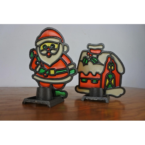 131 - Two coloured glass Christmas candle holders.