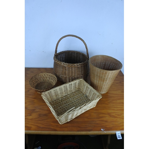 140 - A vintage wicker shopping basket and two others.