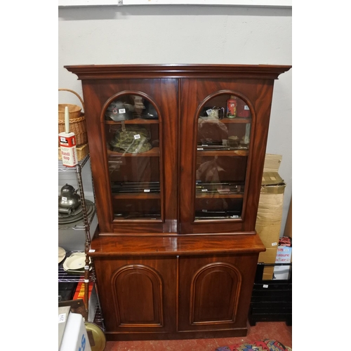 A stunning antique mahogany two door bookcase, measuring 210cm X 121cm X 48cm.