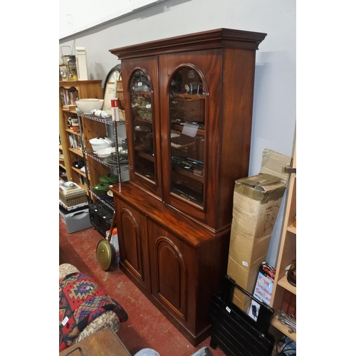 151 - A stunning antique mahogany two door bookcase, measuring 210cm X 121cm X 48cm.