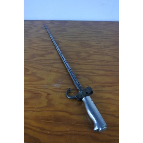 156 - A bayonet, measuring 64cm long.