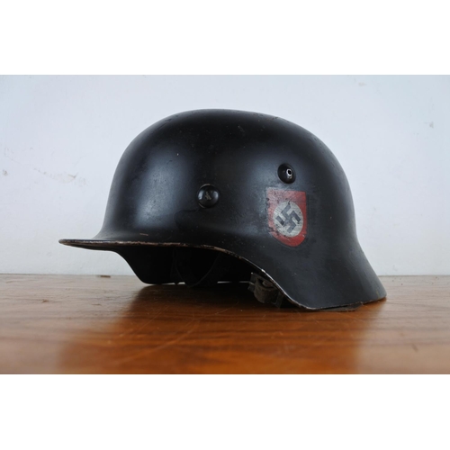 167 - A replica WW2 era German helmet with decal.