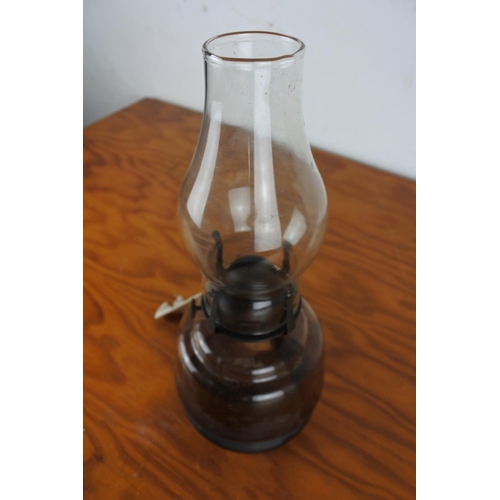 179 - A vintage glass finger lamp.