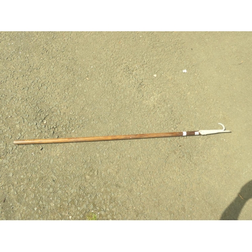 206 - A wooden pole with metal boat hook.