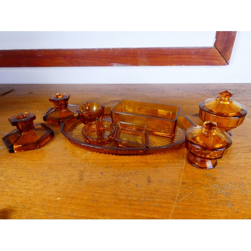 216 - A vintage Art Deco amber glass dressing table set.