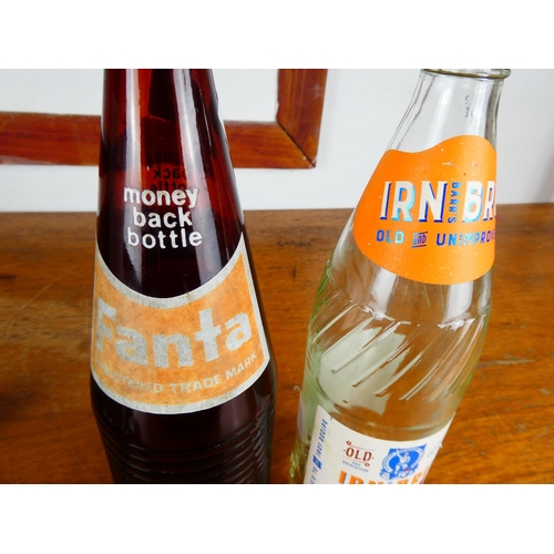 222 - A Fanta glass bottle and a Iron Bru glass bottle.