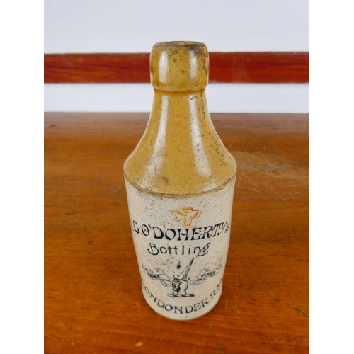 252 - An antique stoneware bottle, 'W.G.O'Doherty's bottling - Londonderry'.