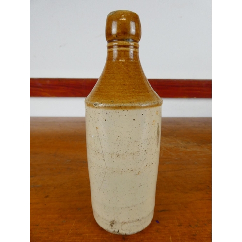 254 - An antique stoneware bottle, 'Bottled by Osborne and Patton - Limited - Londonderry'.