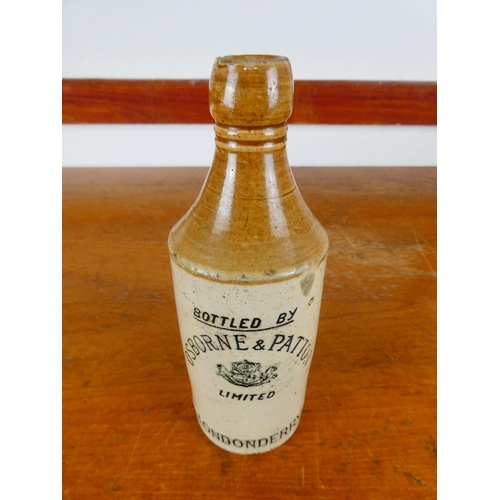 254 - An antique stoneware bottle, 'Bottled by Osborne and Patton - Limited - Londonderry'.