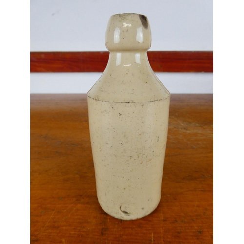 255 - An antique stoneware bottle, ' Belfast Mineral Water - Compy. Limited - Stone Ginger Beer'.