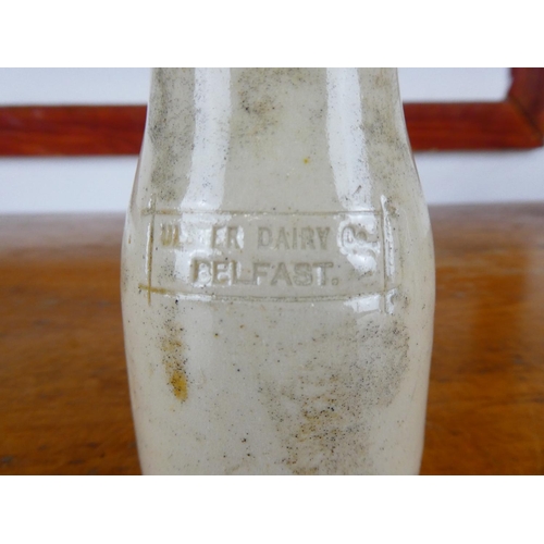 256 - An antique stoneware milk bottle, ' Ulster Diary Co - Belfast'.