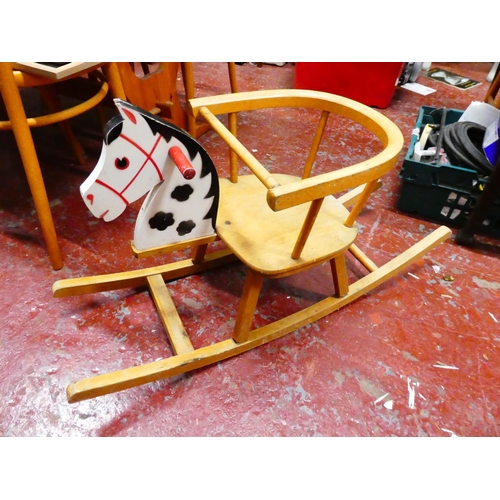 291 - A vintage wooden child's rocker.