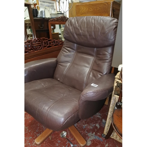 300 - A brown leather swivel lounge chair.