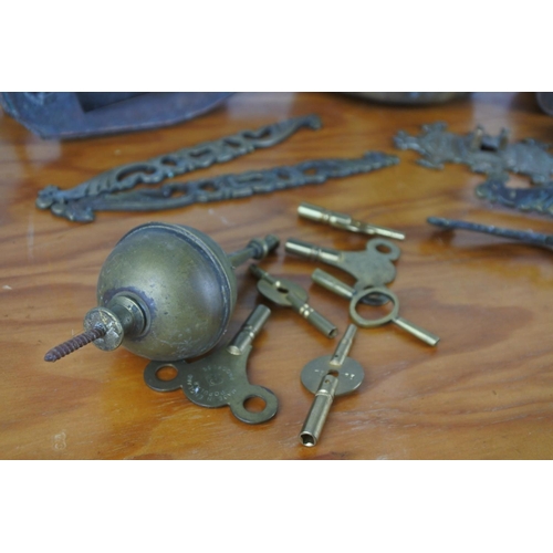 304 - A small brass handled pot and a lot of picture hooks, brass door handle and more.