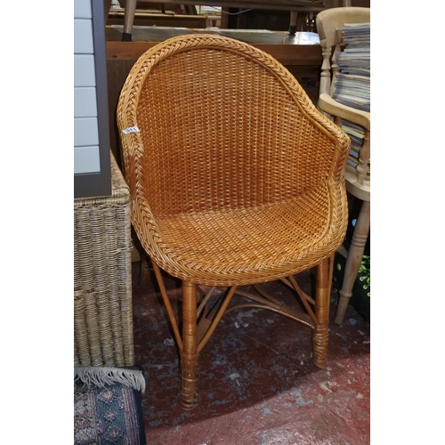 311 - A vintage wicker chair.