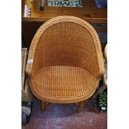 311 - A vintage wicker chair.