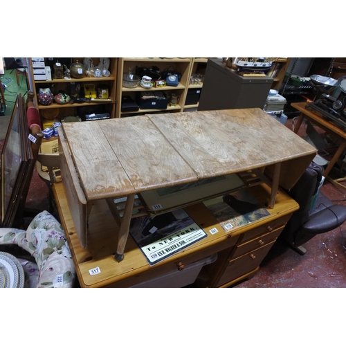 317 - A vintage Ercol extending coffee table for restoration.