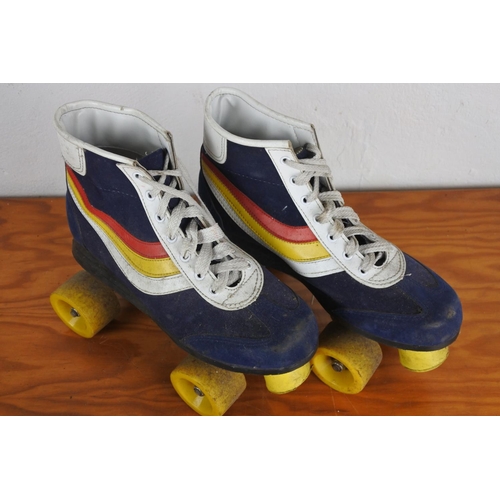 324 - A pair of vintage roller boots.