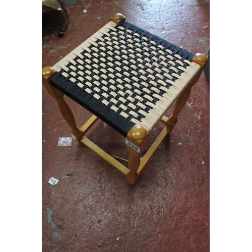 329 - A vintage rattan topped stool.