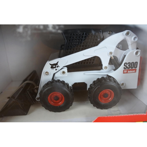 345 - A boxed Britains Bobcat S300 skidsteer.