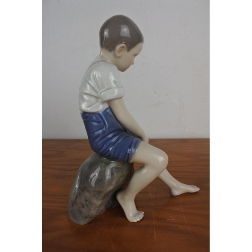 358 - A Royal Copenhagen figurine 1757 KFN 'Boy at Beach'