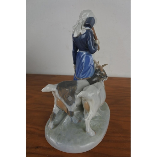 360 - A large Royal Copenhagen figurine 694 'Girl with Goats' (a/f).