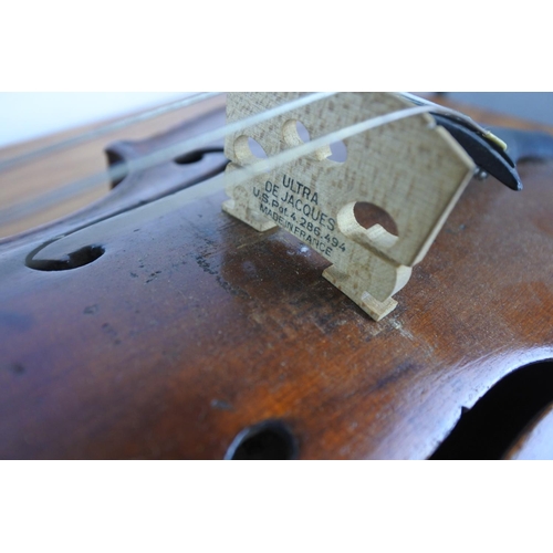 372 - An antique violin stamped to rear, 'Paganini' with bow.